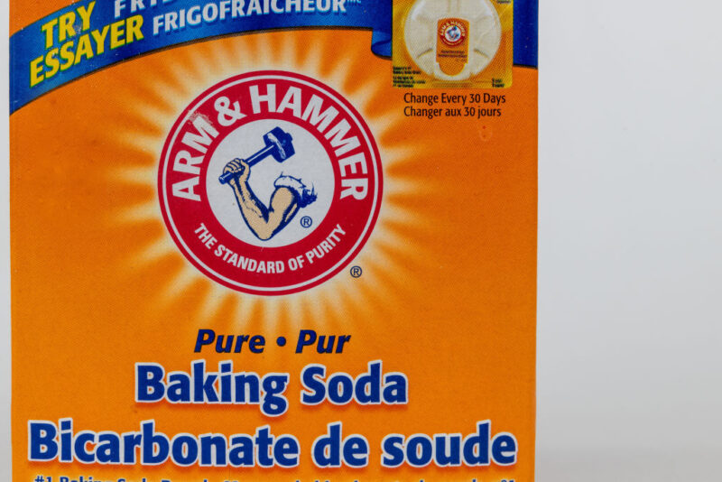 Arm & Hammer baking soda box against a grey backdrop