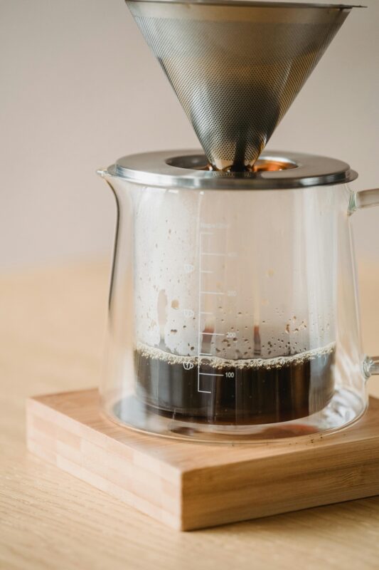 Coffee pot partially filled with coffee