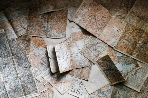 multiple maps layered and displayed on table
